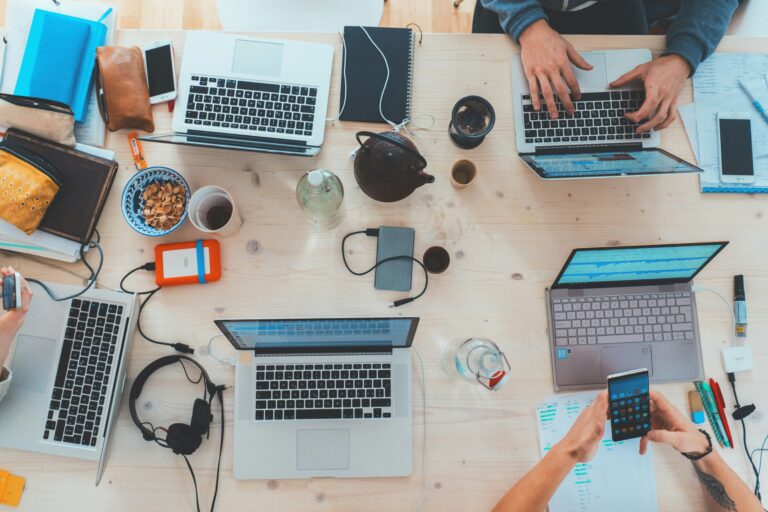 Laptops on a table doing Fractional marketing