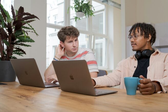 Two People Discussing How To Hire A Great Product Manager In 2025